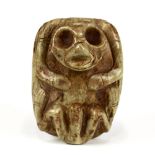 Taíno society carved marble anthropic cemi, depicting interlocking bird head symbols verso,