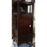 Chinese apothecary cabinet, with an open shelf, the back pierced with prunus, above a section of