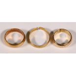 (Lot of 3) Yellow gold bands Including 1) 18k yellow gold, 5.75 mm band, size 6 1/4; (2) 14k