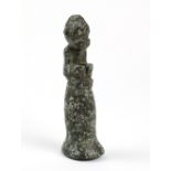 Taíno society granite stone pestle, the splayed cylindrical form surmounted by a seated anthropic