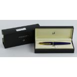 Alfred Dunhill fountain pen, having a indigo blue cap and barrell and an 18k yellow gold nib, with