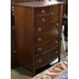 Late Victorian mahogany bachelors chest, having a hinged mirror above the six drawer case, 68"h