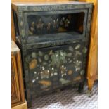 Chinese overlaid lacquered cabinet, with an open shelf above hinged double doors decorated with