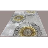 Moderne "Cosmo" wool machine made carpet, having a taupe field with stylized floral reserves, 7'