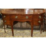 Federal mahogany demi-lune sideboard circa 1820, having a single central drawer, flanked one side by