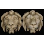 Pair of lionhead architectural elements, 20th Century, resin cast, 6"l