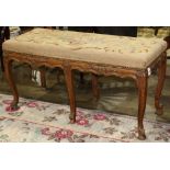 Continental needlepoint bench, the needlepoint with a floral motif, having a rectangular top over