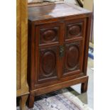 Pair of Chinese small cabinets, the hinged double doors inset with panels painted with Daoist