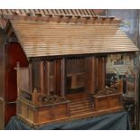 Japanese Shinto shrine, of pawlonia wood with a flight of stairs leading to three pairs of hinged