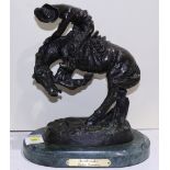 After Frederic Remington (American, 1861-1909), "Rattlesnake," bronze sculpture on marble base,