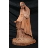 Terracotta figural sculpture, depicting a draped figure, impressed with "D" on underside of base,