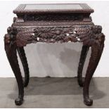 Japanese wooden table, with a square top within a key-fret edge, the apron pierced with