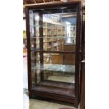 Modern custom mahogany lighted display cabinet, having rectangular form with (4) adjustable glass