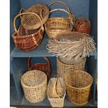 Two shelves of modern reed woven baskets, in various sizes, some with handles, largest: 18"h