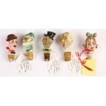 (lot of 5) Ceramic figural bottle stopper group, second quarter 20th century, each depicting a