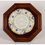 Framed Meissen porcelain plate, within an octagonal wood frame, the plate having a gilt shaped