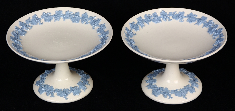 Pair of Wedgwood compotes, executed in the "Embossed Queensware" style, having a white ground with