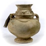 Pre-Columbian Chimila style ceramic offering urn depicting the rain god man-frog, the bulbous form