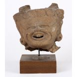 Pre-Columbian Veracruz ceramic head fragment of a lord or deity, the pronounced brow narrowing to an