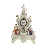 (lot of 3) Meissen porcelain figural porcelain clock with garniture, executed in the Bacchanalian