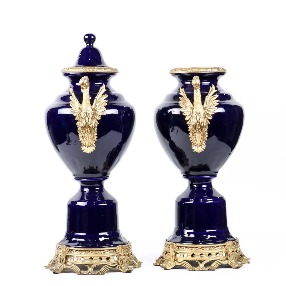 Pair of Sevres style porcelain mounted urns, executed in cobalt, having double metal mounted swan - Image 2 of 3