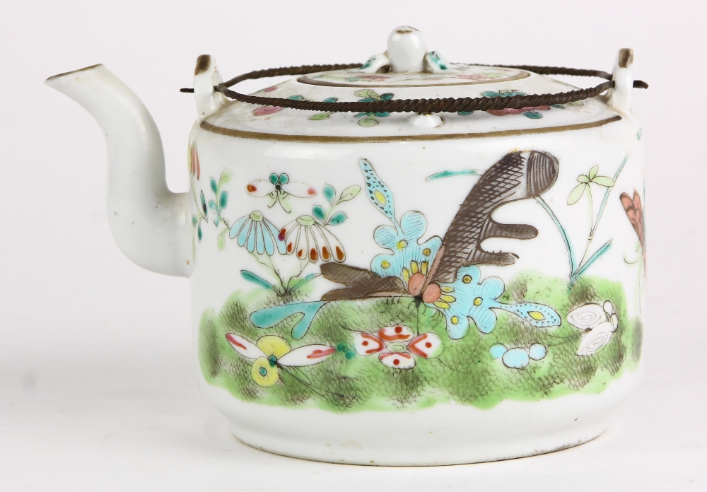 Chinese enameled porcelain teapot, decorated with butterflies and flowers, the lid mounted with a