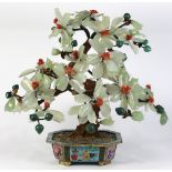 Chinese hardstone flowering tree, with celadon colored flowers, issuing from a cloisonne enameled