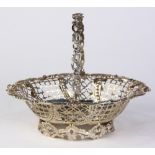 George III silver swing handle sugar basket, London 1764, by Edward Aldridge, the chased handle