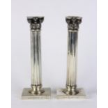 Pair of Italian Tiburizo .800 silver candlesticks, 20th Century, each standard as a Corinthian