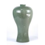 Korean celadon vase, with a short neck, the body decorated with lotus petals and suffused with