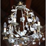 French tole decorated chandelier, having floral decorated accents flanking the six lights, 24"h