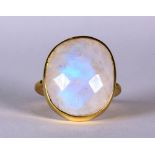 Moonstone and silver-gilt ring Featuring (1) oval-shaped moonstone cabochon, measuring approximately