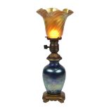 Arts and Crafts iridescent art glass table lamp attributed to Steuben, having a signed Steuben