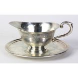 Cartier sterling silver creamer and saucer, 3"h x 6"dia. 8.75 troy oz.