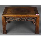 Chinese hardwood low stand (kangzhuo), inset with a floating panel, fronted by a pierced scroll