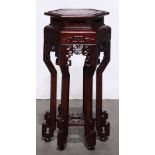 Chinese wood stand, of hexagonal form, the openwork apron pierced with shou medallions, on shaped