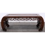 Chinese hardwood low table, inset with a single floating panel, with a pierced scroll apron,