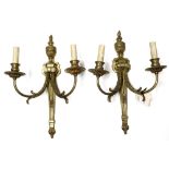 Pair of Neoclassical style crystal and bronze wall sconces, each 2-light fixture with ribbon