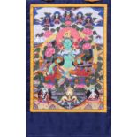 Himalayan painted thangka, Green Tara, ink and color on textile, holding a sprig of flowers in