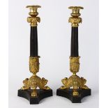 Louis XV style gilt bronze candlesticks, having an acanthus decorated bobeche continuing to the