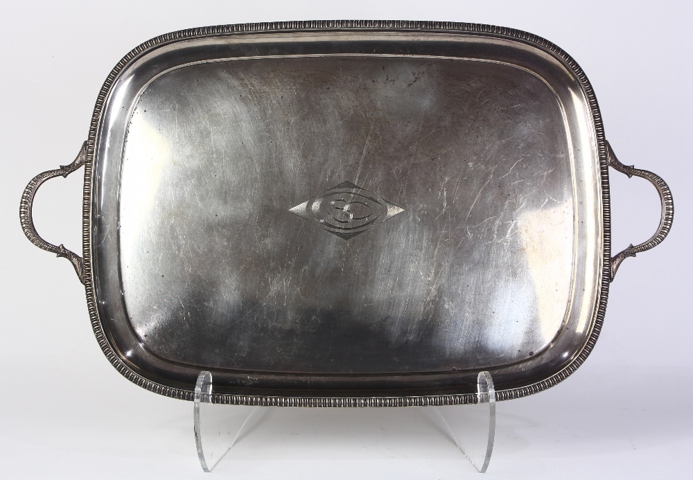 English sterling silver tray, 1905, by Mappin and Webb, the double handled tray with gadrooning rim,