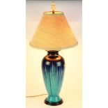 Mid Century drip glazed ceramic lamp, of urn form, having a cobalt to robin's egg blue body and