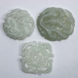 (lot of 3) Chinese hardstone plaques: one archaistic disc with stylized dragons; one with a bird and