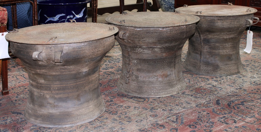 (lot of 3) Southeast Asian bronze/copper alloy rain drums, each centered with a star burst encircled