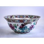 Chinese enameled porcelain bowl, with a long tail pheasant amid peonies, the everted rim decorated