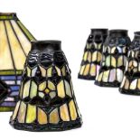 (lot of 5) Tiffany style leaded glass shades, consisting of four polychrome decorated examples,