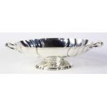 German .800 silver footed serving dish, 20th Century, the oval form bowl with scallop rim, flanked