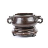 Chinese bronze censer, the globular body flanked by elephant form handles, the recessed base marked,