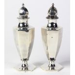 Pair of American sterling silver salt shakers circa 1900, by Howard Sterling Co., each urn form with