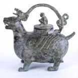 Chinese archaistic bronze pouring vessel, in the form of a mythical beast, the lid on its back